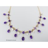 An early 20th century yellow metal, amethyst, aquamarine and seed pearl set drop fringe necklace,