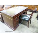 An Edwardian mahogany pedestal desk, length 138cm, depth 75cm, height 74cm together with a George