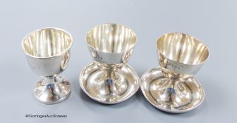 A pair of 1950's silver egg cups, Walker & Hall, Sheffield, 1957/8, 55mm and one other silver egg