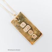 A modern 9ct gold ingot on a 9ct gold chain, chain 44cm, 9.4 grams.