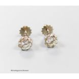 A modern pair of 18ct and solitaire diamond set ear studs, each stone weiging approximately 0.65ct-