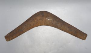 A carved wood boomerang, 19th/20th century, length 50cm