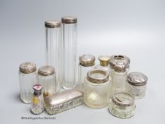 A group of assorted silver topped toilet jars, largest 17cm.