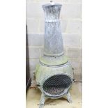 A weathered metal garden chiminea, height 140cm