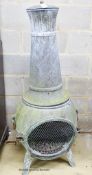 A weathered metal garden chiminea, height 140cm