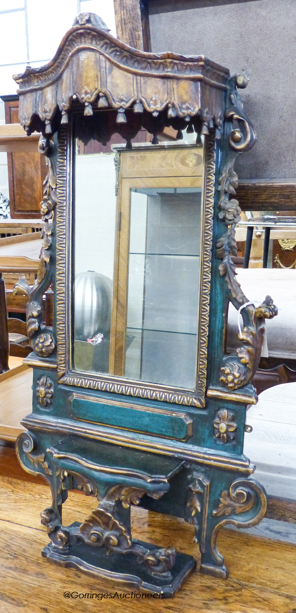 An Iberian green-painted and parcel-gilt rectangular wall mirror,foliate-carved and pierced and