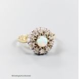 A modern 14k, white opal and illusion set diamond circular cluster ring, size L, gross 4.7 grams.