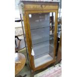 A late 19th century Louis XV style vitrine, with a shaped marble top above a single glazed panelled