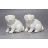 Two Japanese Hirado models of seated puppies, 19th century, 11cm tall