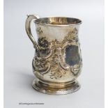 A George II provincial silver baluster mug, with later embossed decoration, James Kirkup,