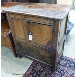 A 17th century oak low cupboard of rectangular form,fitted two cupboards, the upper door off