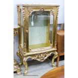 A marble topped gilt vitrine, width 73cm, depth 41cm, height 137cm