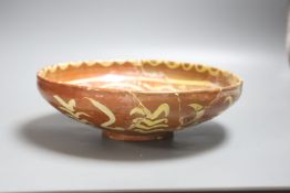 A Persian slipware bowl, circa 10th century, 24.5cm (a.f.)