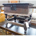 A 17th century oak box stool with hinged rectangular seat, width 46cm, depth 38cm, height 42cm