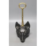 A cast iron and brass foxhead doorstop, 30cm tall