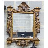 A Renaissance style giltwood wall mirror,having rectangular plate and shaped caryatid frame, width