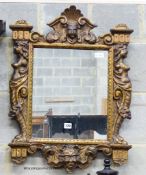 A Renaissance style giltwood wall mirror,having rectangular plate and shaped caryatid frame, width