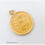 A 1911 Peruvian gold coin, now mounted as a pendant, 8.2 grams.