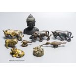 A group of nine Chinese and Oriental bronze figures to include five Han Dynasty style bronzes,