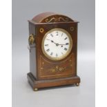 A George IV brass inlaid mahogany mantel clock, with keys and pendulum, height 28cmSingle fusee