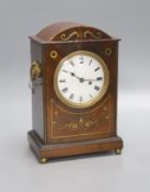 A George IV brass inlaid mahogany mantel clock, with keys and pendulum, height 28cmSingle fusee