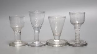 Four Georgian 'Toast Master' glasses, one with opaque twist stem, c.1760-80