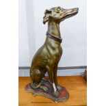 A gilt composition seated greyhound, height 78cm