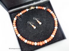 A modern Pruden Smith coral and white metal bead necklace, approx. 42cm and a pair of matching drop