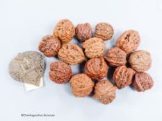 A quantity of walnuts and a Balinese coconut shell heart shaped panel