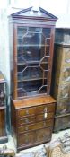An early 20th century George III style narrow mahogany bookcase on chest, width 65cm, depth 44cm,