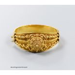 A 20th century Victorian style yellow metal (stamped 19k) cannetile work hinged bracelet, interior