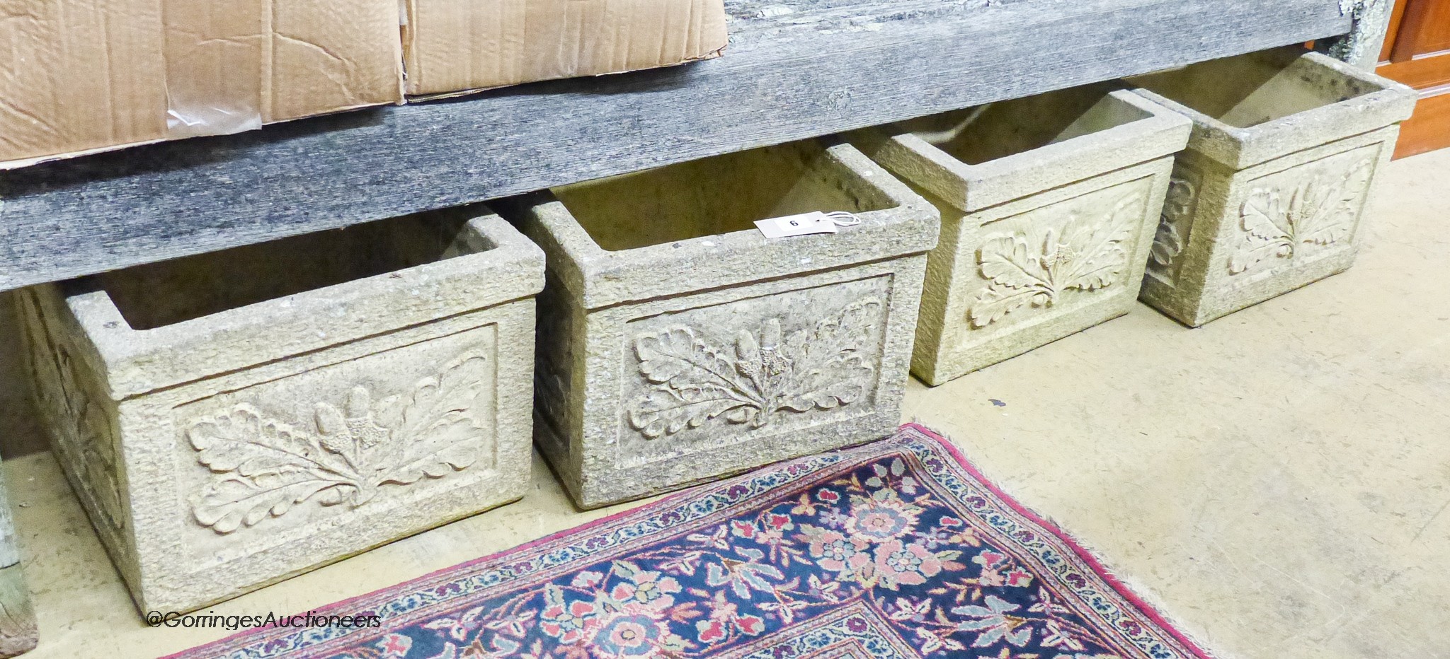 A set of four garden planters moulded with oak leaves and acorns, width 37cm, depth 37cm, height