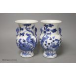 A pair of Chinese blue and white 'phoenix' vases, Kangxi marks but late 19th century, height 20cm (