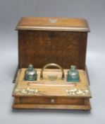 An Edwardian oak stationery box and an oak inkstand