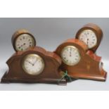 Four Edwardian inlaid mahogany mantel clocks, tallest 24cm