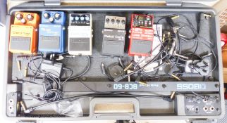 A Boss BCB-60 pedal board, Boss metal core ML-2 pedal, Boss loop station RC-3 pedal, Boss