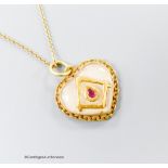 A yellow metal, ruby and paste? set heart shaped pendant with masonic motif, 17mm, on a 9ct chain,