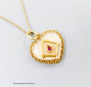 A yellow metal, ruby and paste? set heart shaped pendant with masonic motif, 17mm, on a 9ct chain,