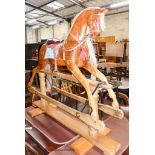 An Edwardian Lines Bros. pine rocking horse, length 144cm, height 126cm