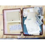 A suitcase of mostly early world stamps in albums packets with a 1937 coronation, 1945 victory