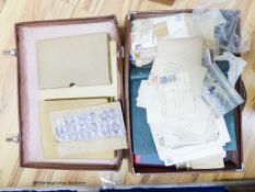 A suitcase of mostly early world stamps in albums packets with a 1937 coronation, 1945 victory