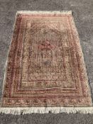 A North West Persian red ground rug, decorated with Saz leaf field, 190 x 125cm
