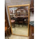 A contemporary rectangular gilt framed wall mirror, W.150cm H.96cm