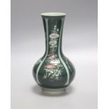 A green Japanese artisan studio vase decorated with flower designs, 20cm tall