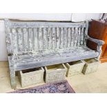 A weathered teak garden bench, length 182cm, depth 68cm, height 94cm