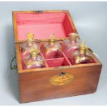 A mahogany inlaid decanter box containing five gilt decorated decanters