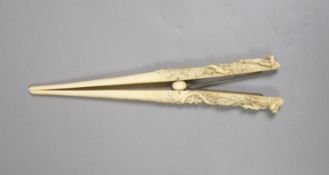 A pair of late 19th century carved ivory glove stretchers
