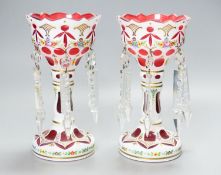 A pair of Bohemian style white and ruby overlaid glass table lustres, 20th century, 20.5 cm high