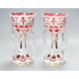 A pair of Bohemian style white and ruby overlaid glass table lustres, 20th century, 20.5 cm high