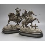 A pair of spelter figures on horseback